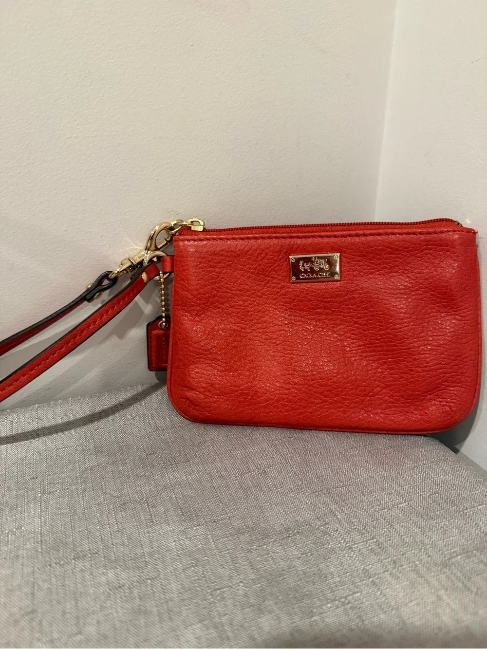 Coach Coral Leather Wristlet with Gold Plaque